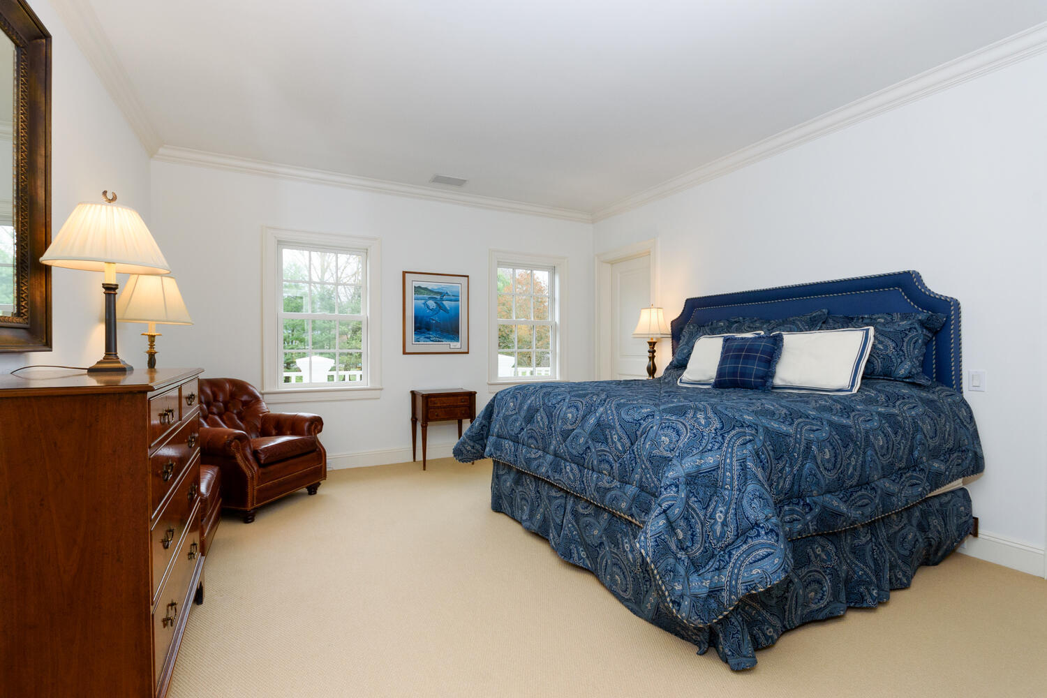 300 Brookside Road Darien, CT 06820 - Photo 34 of 58 a bedroom with a bed large window and lamp