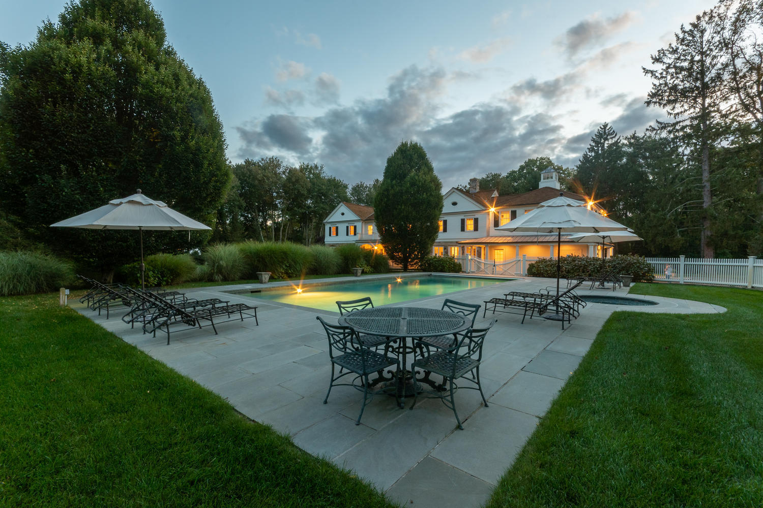 300 Brookside Road Darien, CT 06820 - Photo 51 of 58 a view of a house with backyard sitting area and garden