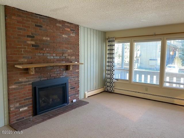 919 Red Sandstone Road, Unit A12 Vail, CO 81657 - Photo 3 of 9 living room sand stone