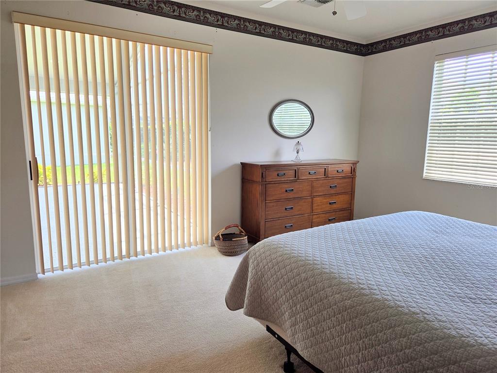 9222 Bonnington Drive Trinity, FL 34655 - Photo 15 of 37 a bedroom with a bed and a window