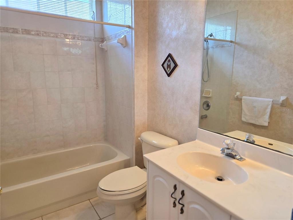 9222 Bonnington Drive Trinity, FL 34655 - Photo 22 of 37 a bathroom with a sink a toilet and shower