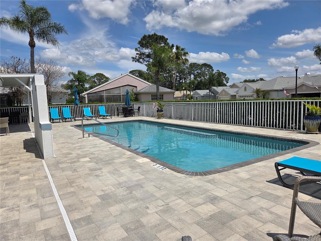 9222 Bonnington Drive Trinity, FL 34655 - Photo 34 of 37 a view of a house with swimming pool and sitting area