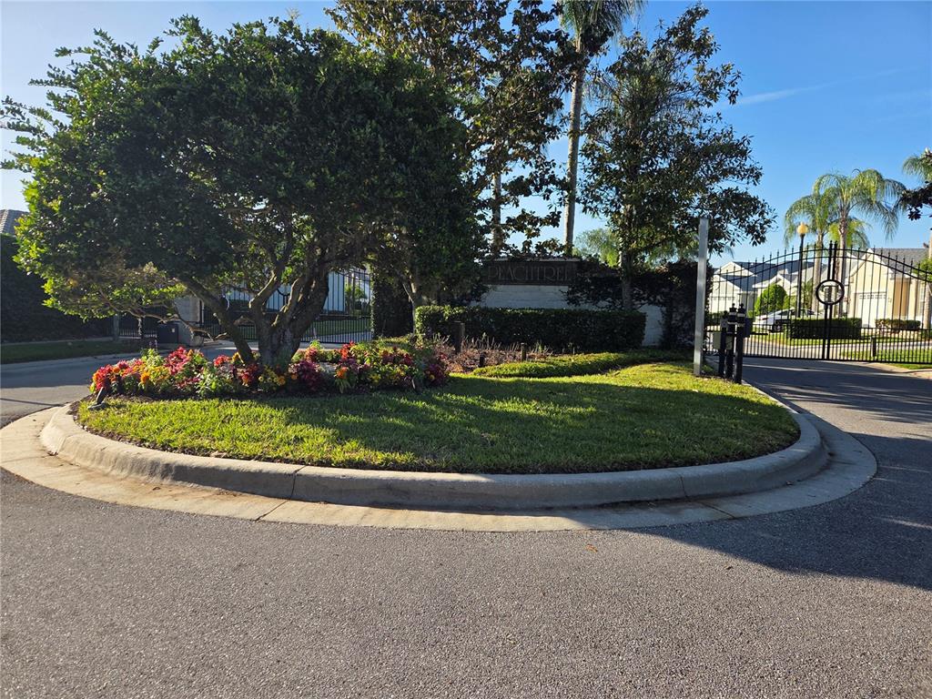 9222 Bonnington Drive Trinity, FL 34655 - Photo 36 of 37 a view of a white house with a small yard and plants