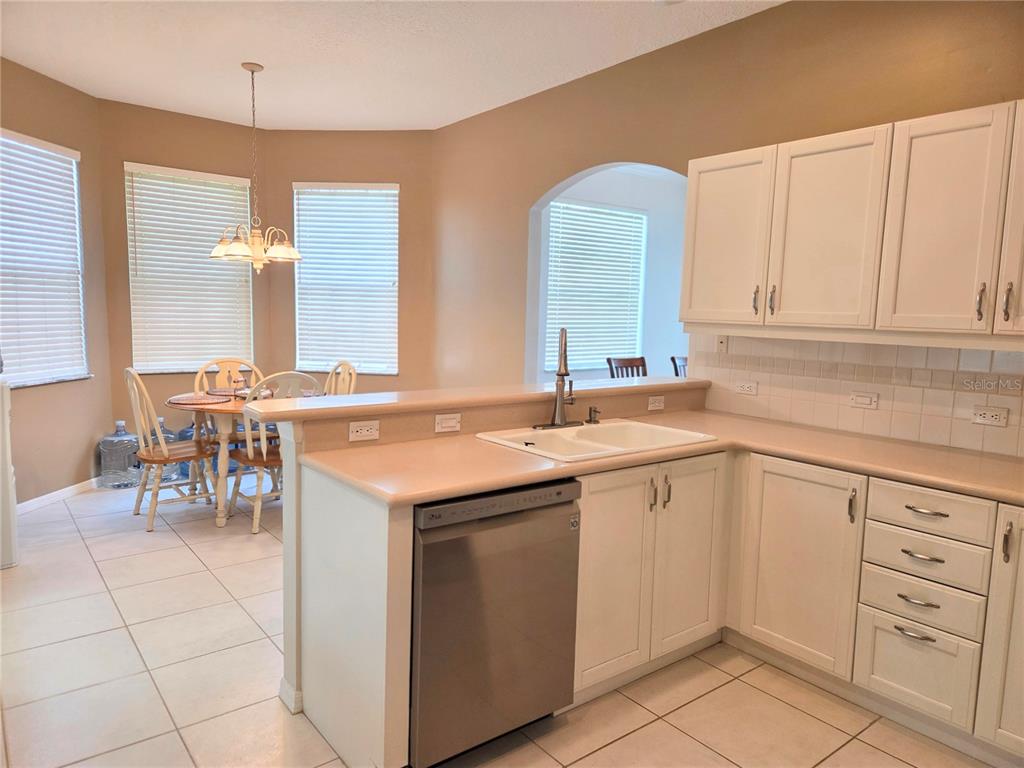 9222 Bonnington Drive Trinity, FL 34655 - Photo 8 of 37 a kitchen with a sink and cabinets