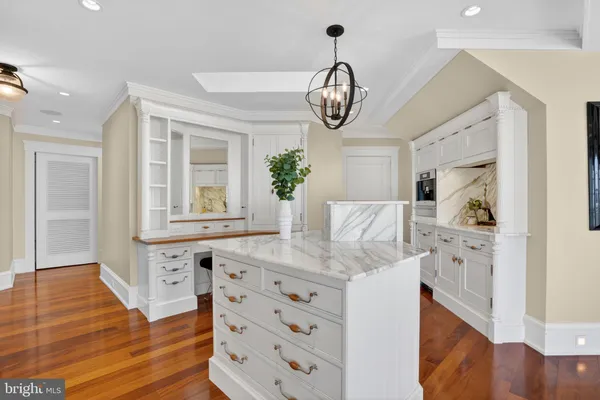 a bedroom with a bed and a television