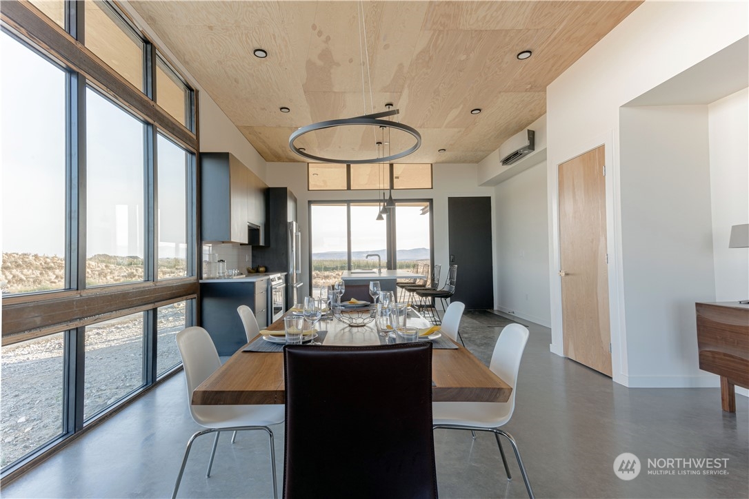 240 Northwest Rattlesnake Point Road Quincy, WA 98848 - Photo 12 of 37 a view of a dining room with furniture window and outside view