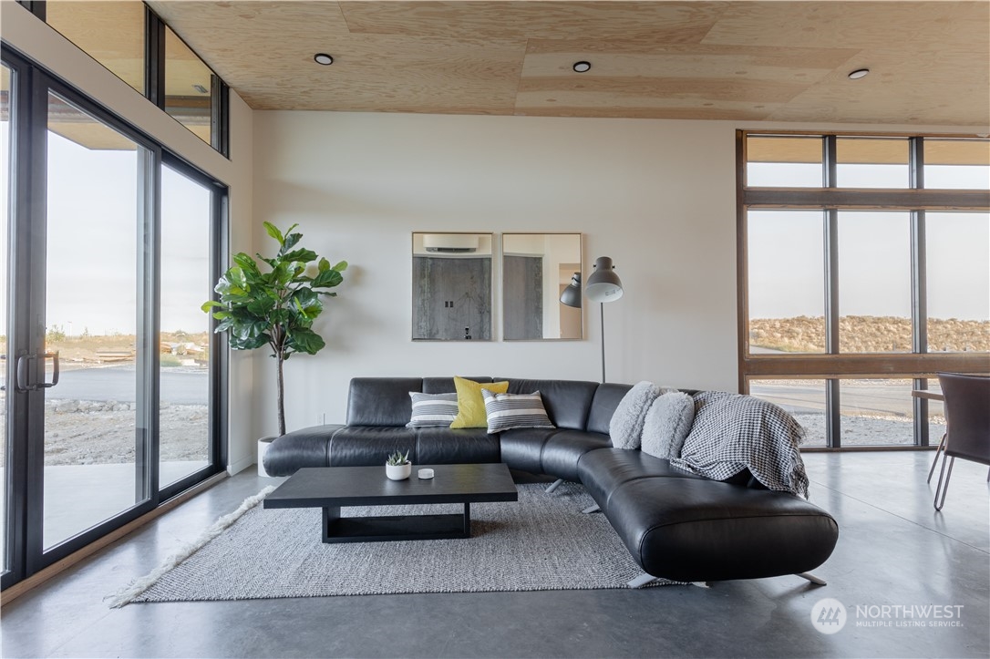 240 Northwest Rattlesnake Point Road Quincy, WA 98848 - Photo 19 of 37 a living room with furniture and a large window