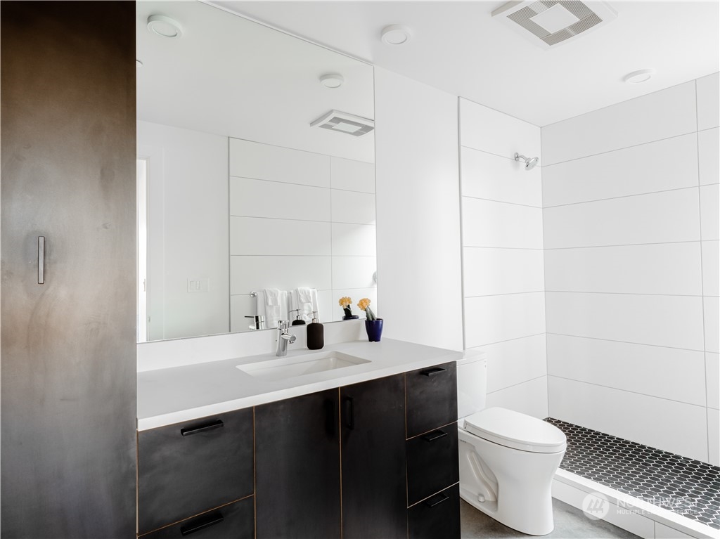 240 Northwest Rattlesnake Point Road Quincy, WA 98848 - Photo 20 of 37 a bathroom with a sink toilet vanity and shower