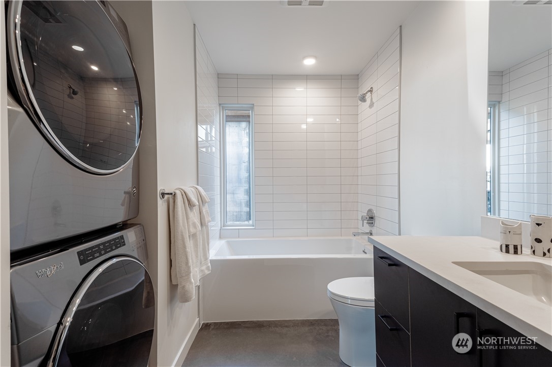 240 Northwest Rattlesnake Point Road Quincy, WA 98848 - Photo 26 of 37 a bathroom with a sink a toilet and a mirror