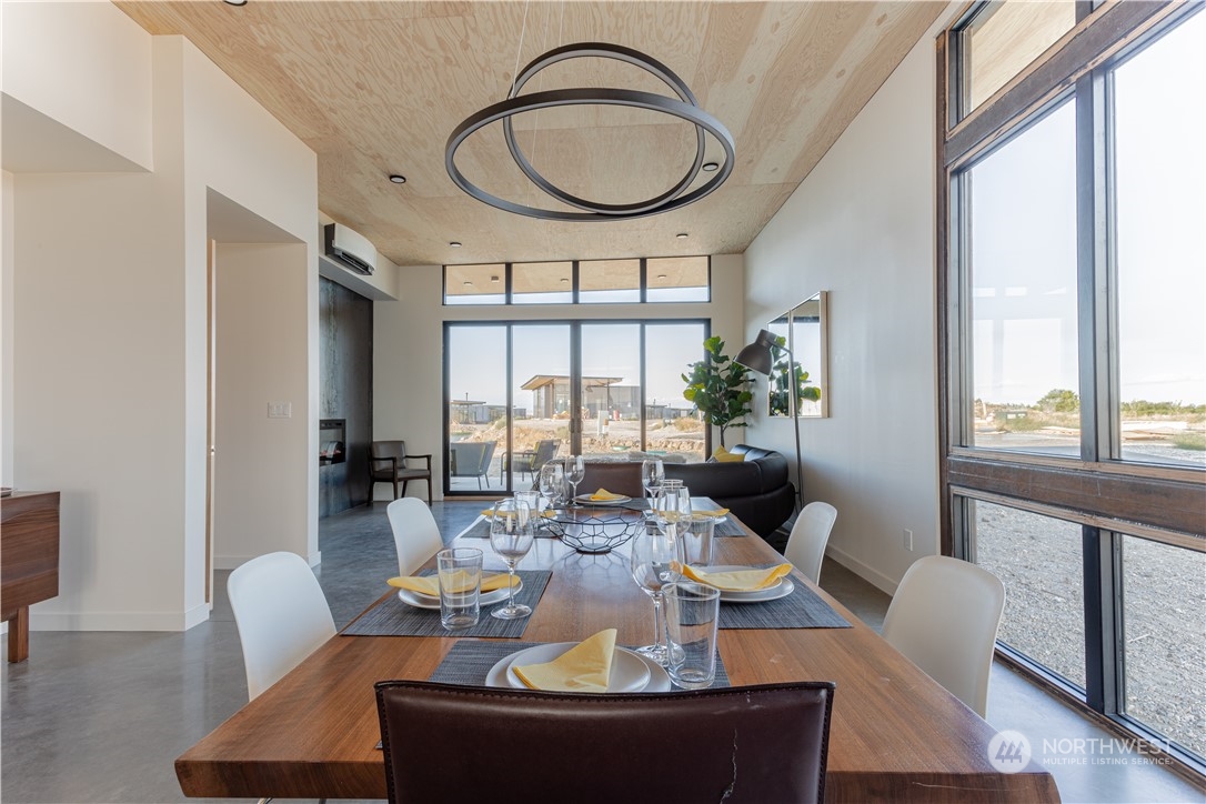 240 Northwest Rattlesnake Point Road Quincy, WA 98848 - Photo 9 of 37 a view of a dining room with furniture window and wooden floor