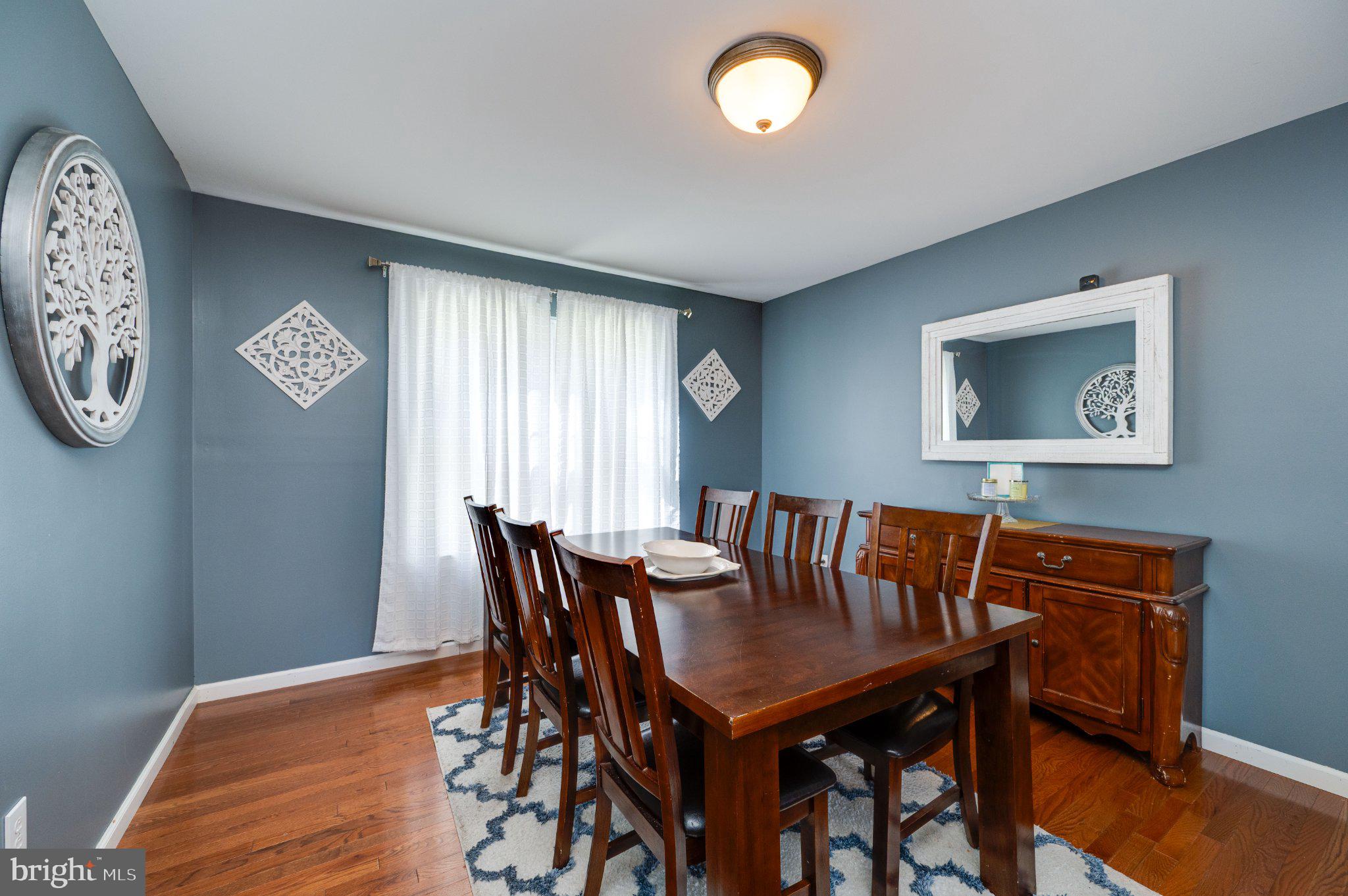 4870 Dunham Drive Reading, PA 19606 - Photo 21 of 59 a view of a dining room with furniture and wooden floor