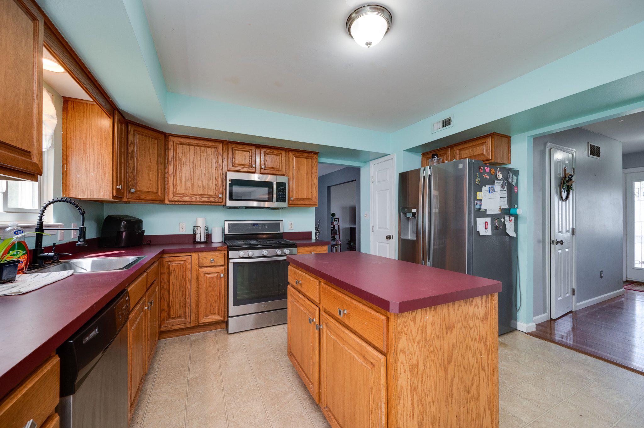 4870 Dunham Drive Reading, PA 19606 - Photo 28 of 59 a kitchen with stainless steel appliances granite countertop a stove refrigerator sink and dishwasher