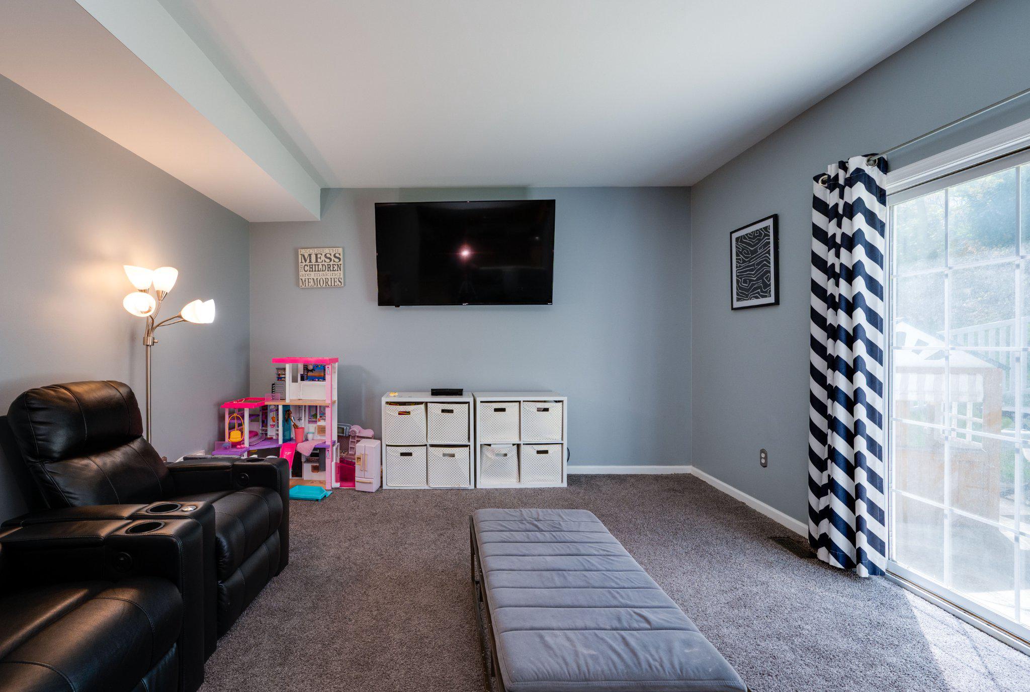 4870 Dunham Drive Reading, PA 19606 - Photo 33 of 59 a living room with furniture and a flat screen tv
