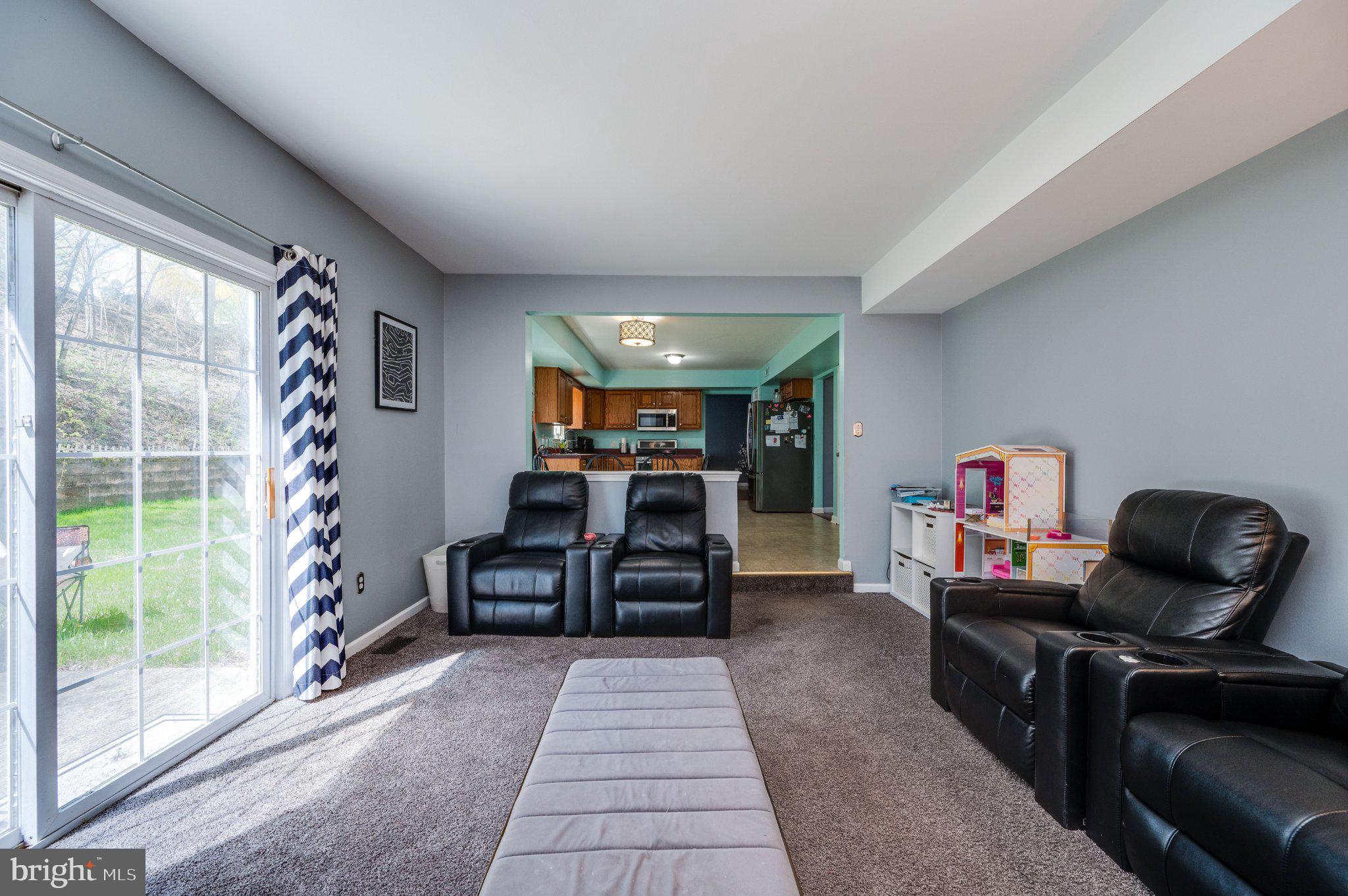 4870 Dunham Drive Reading, PA 19606 - Photo 35 of 59 a living room with furniture and a flat screen tv