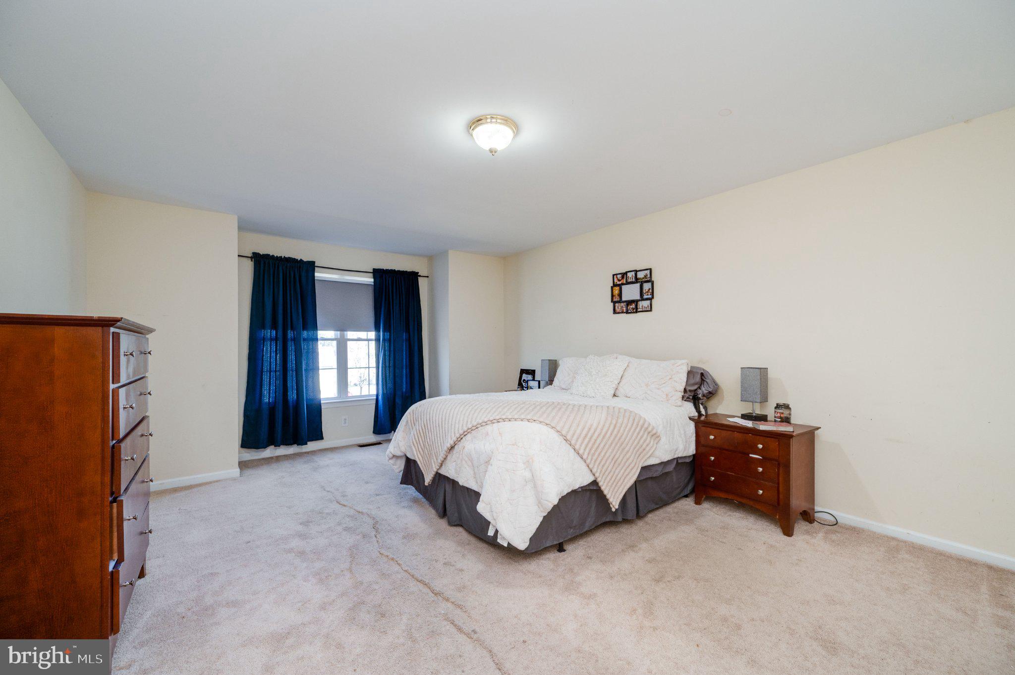 4870 Dunham Drive Reading, PA 19606 - Photo 36 of 59 a spacious bedroom with a bed and a window