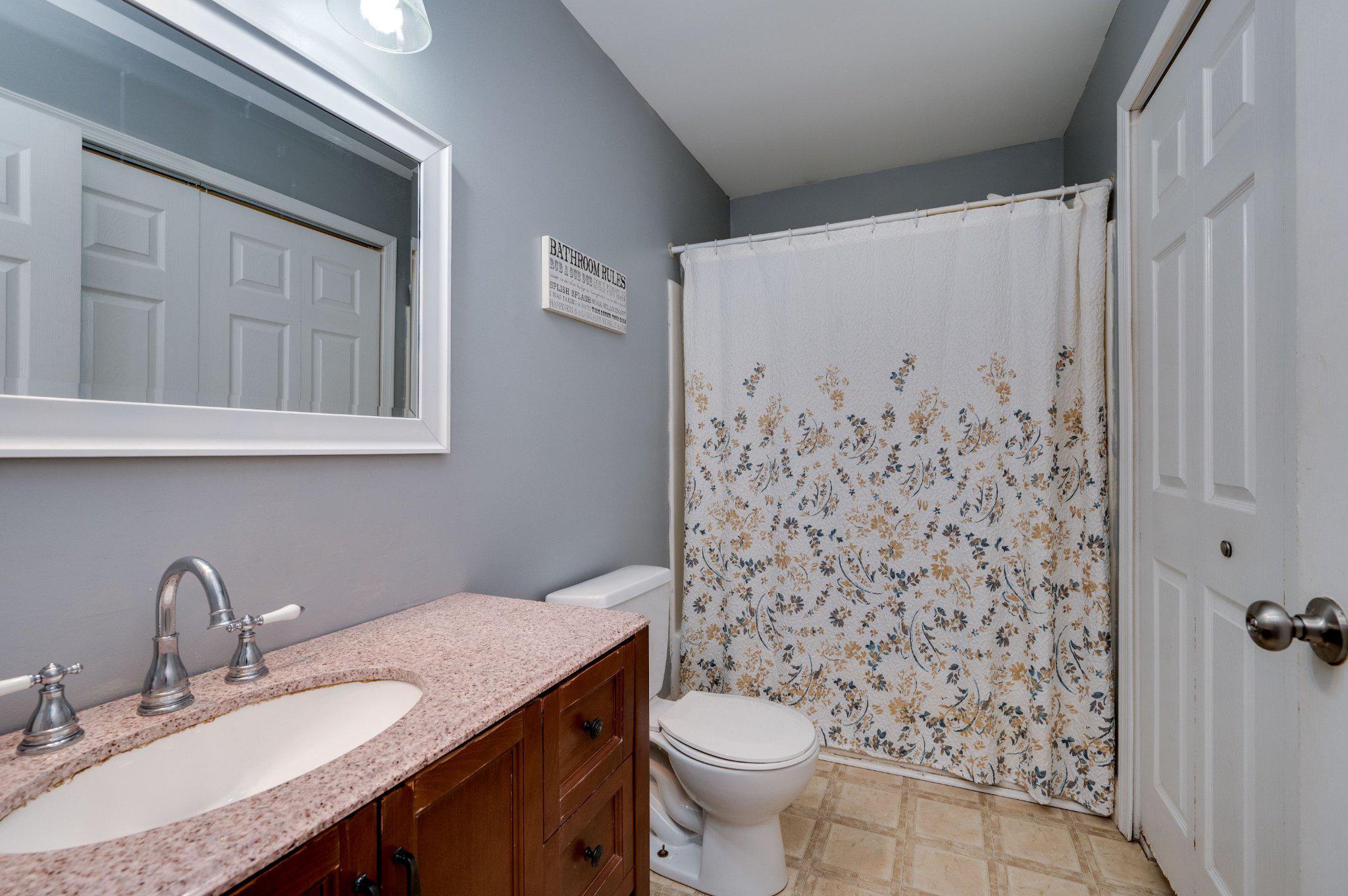 4870 Dunham Drive Reading, PA 19606 - Photo 42 of 59 a bathroom with a granite countertop sink toilet and shower