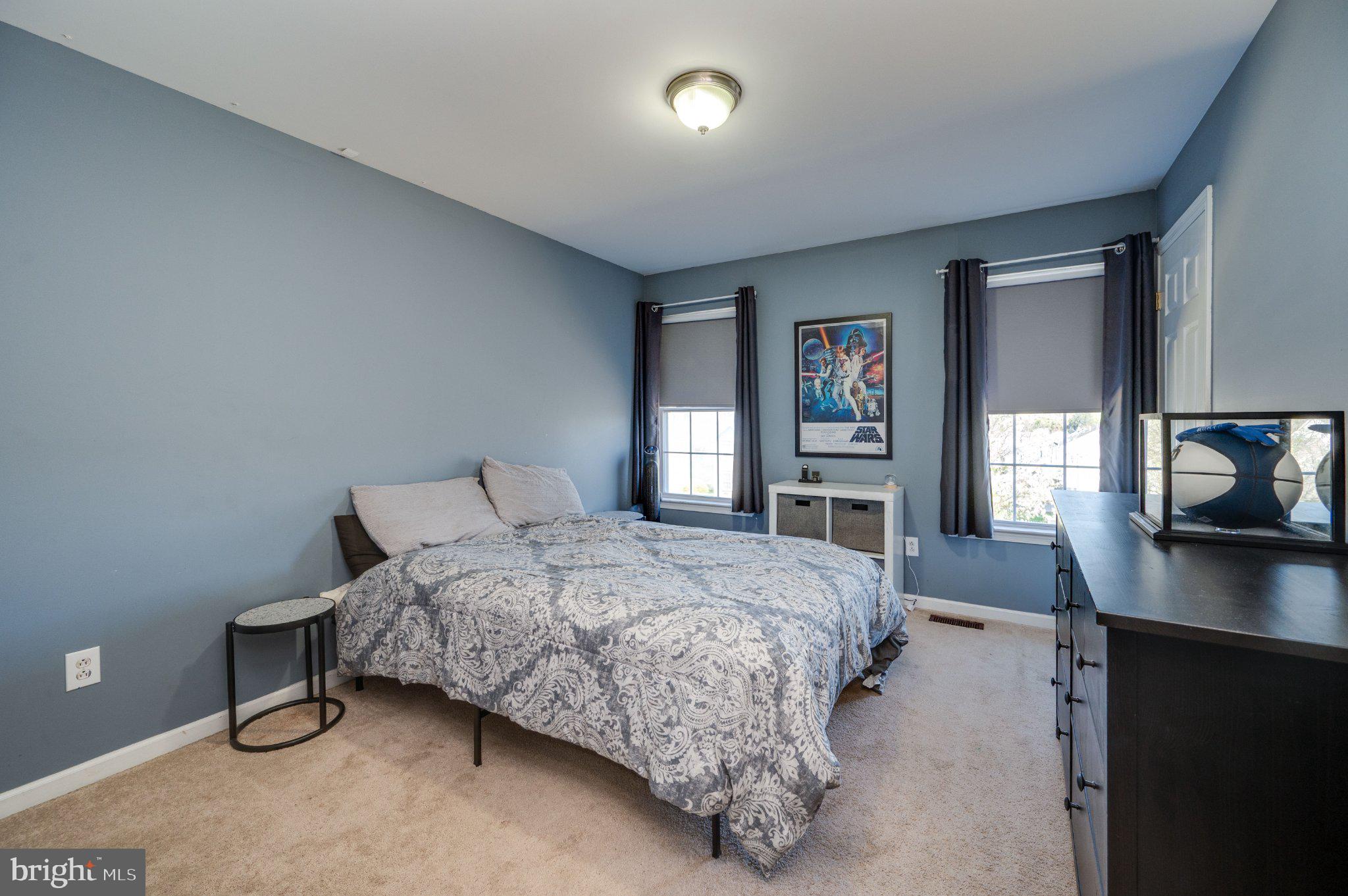 4870 Dunham Drive Reading, PA 19606 - Photo 45 of 59 a bedroom with a bed and a flat screen tv