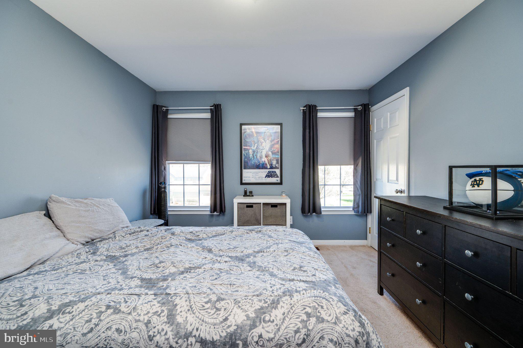 4870 Dunham Drive Reading, PA 19606 - Photo 46 of 59 a bedroom with a large bed and a dresser