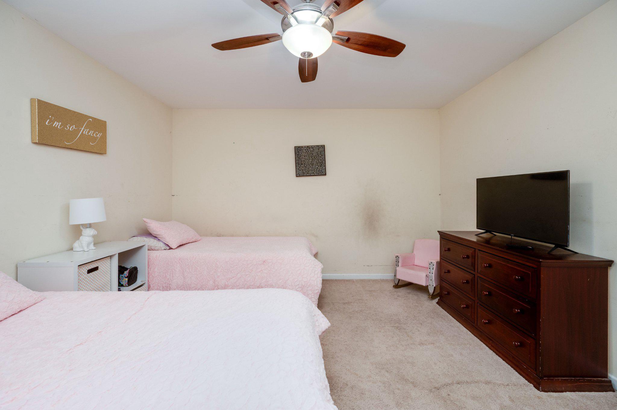 4870 Dunham Drive Reading, PA 19606 - Photo 48 of 59 a bedroom with a bed and a flat screen tv