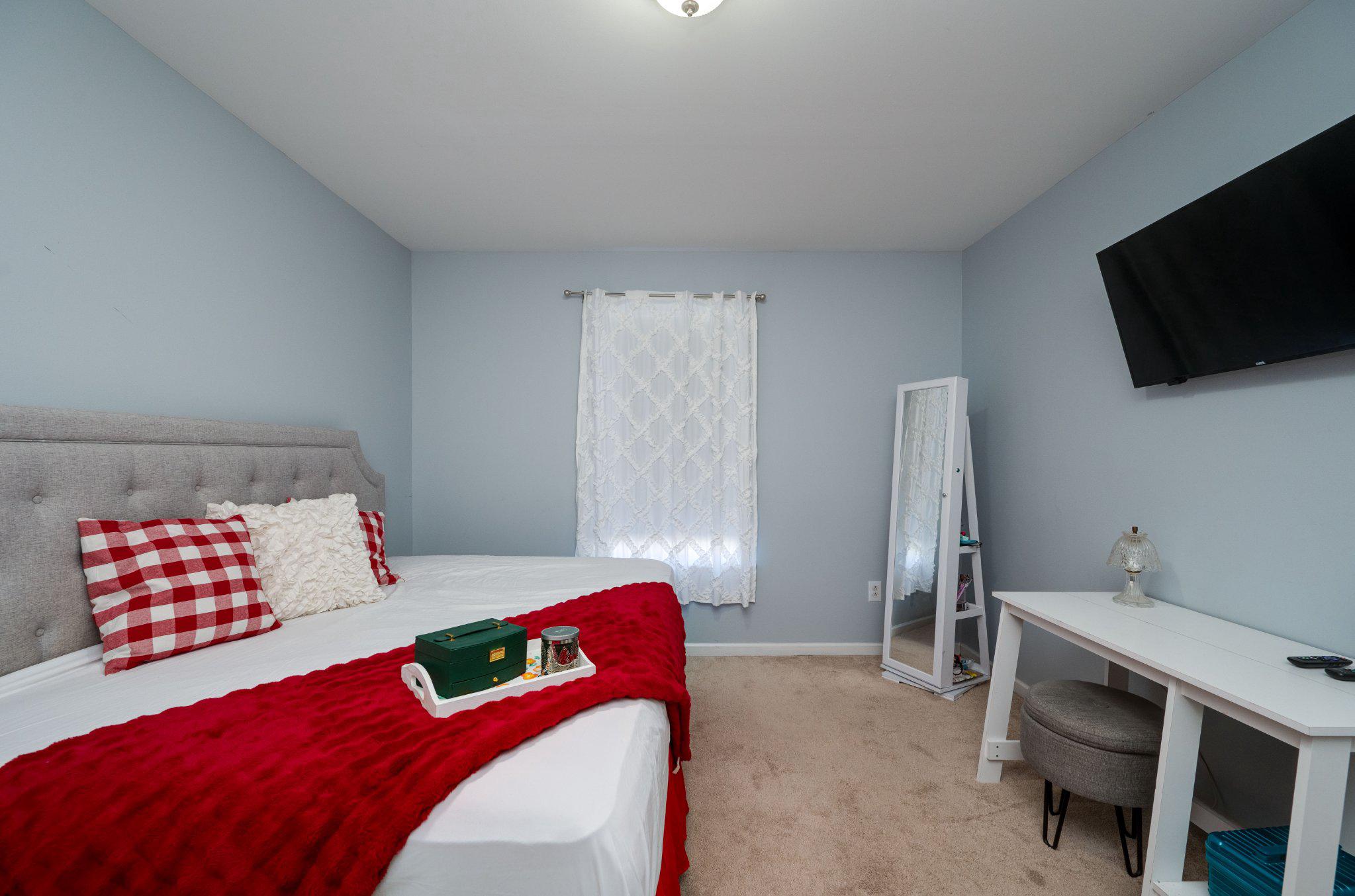 4870 Dunham Drive Reading, PA 19606 - Photo 51 of 59 a bedroom with a bed and a flat screen tv