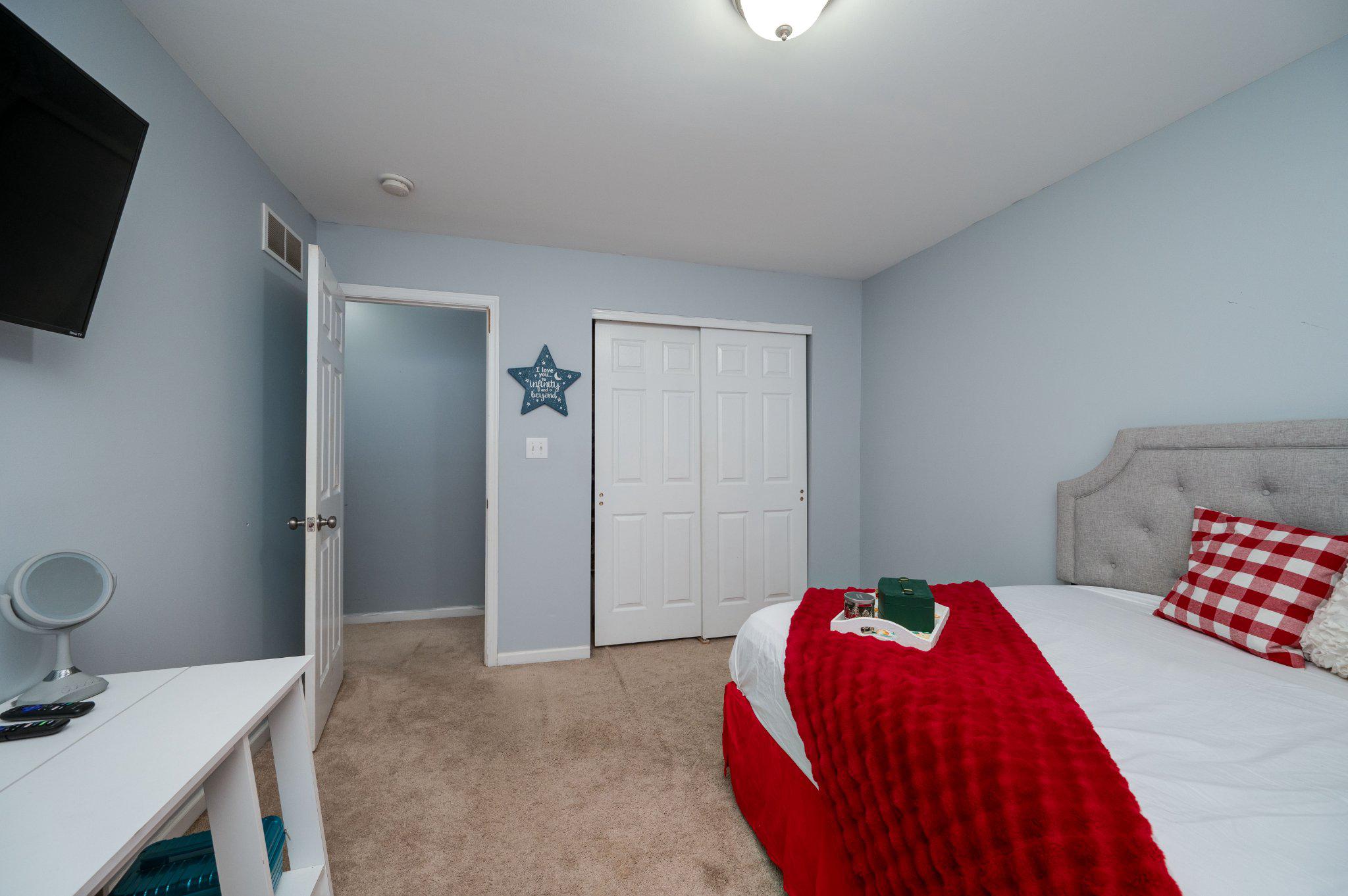 4870 Dunham Drive Reading, PA 19606 - Photo 52 of 59 a bedroom with a bed and a flat screen tv