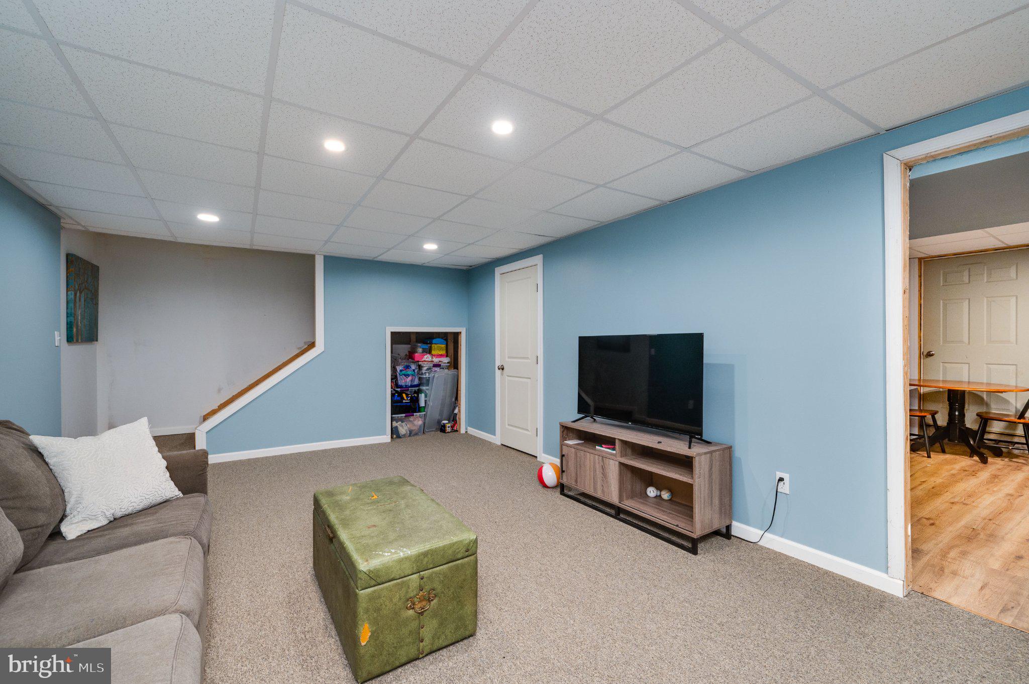 4870 Dunham Drive Reading, PA 19606 - Photo 55 of 59 a living room with furniture and a flat screen tv