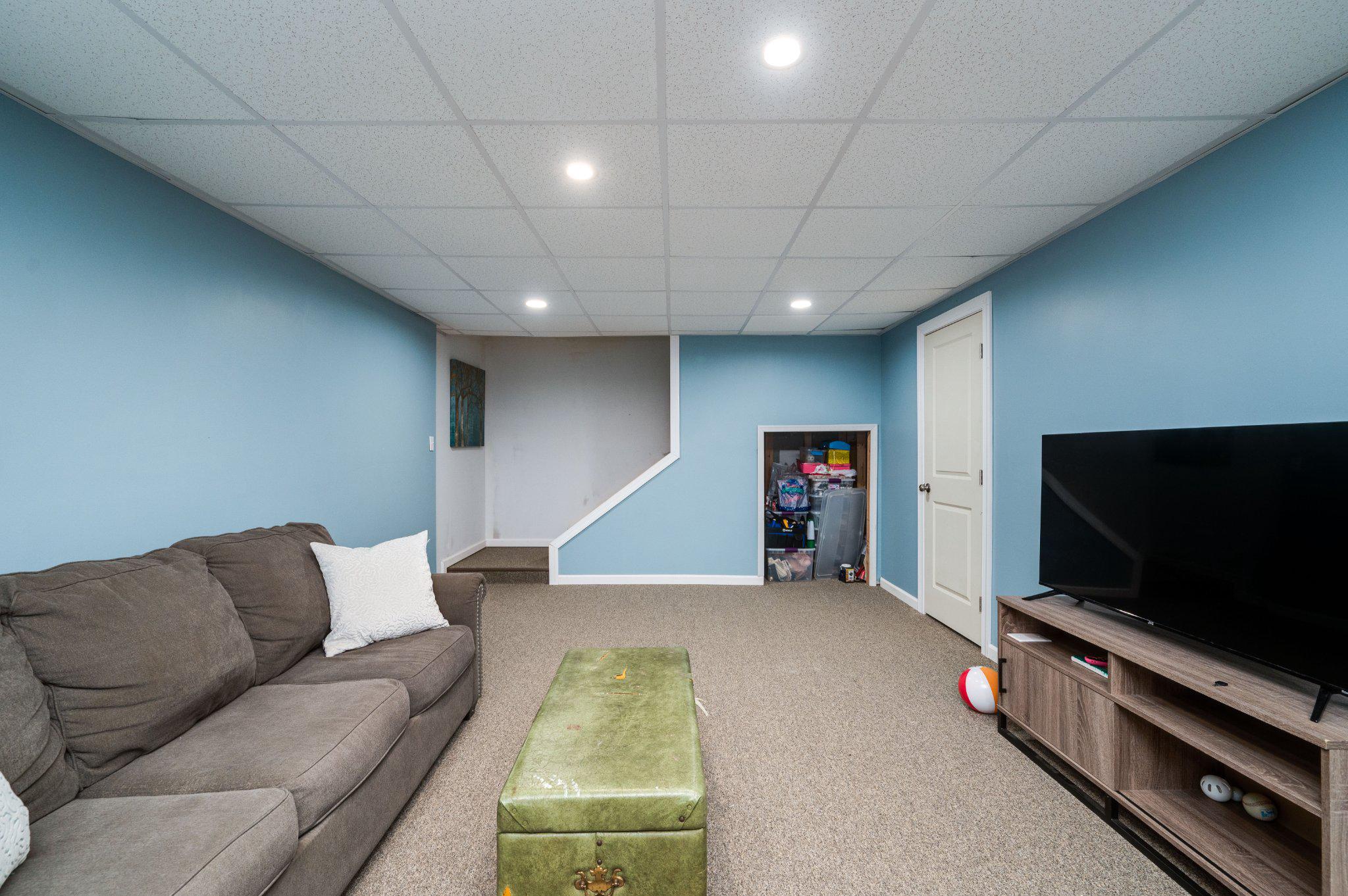 4870 Dunham Drive Reading, PA 19606 - Photo 56 of 59 a living room with furniture and a flat screen tv