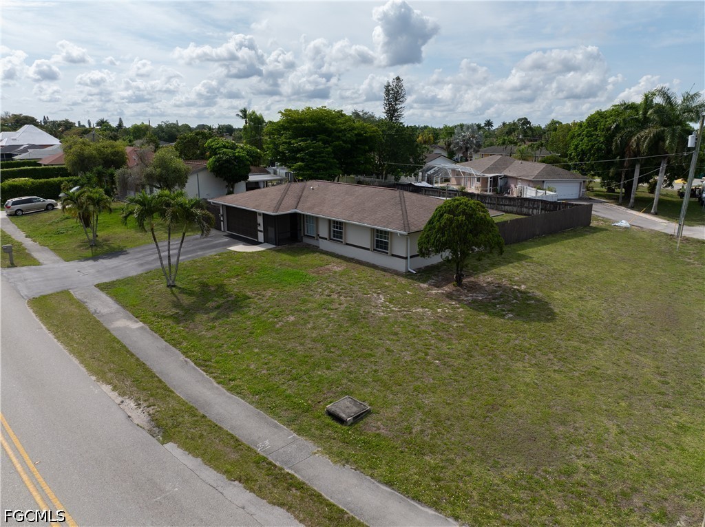 4960 20th Place Southwest Naples, FL 34116 - Photo 31 of 33 a view of house with pool and yard