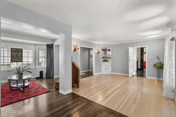 a view of a livingroom with furniture and wooden floor