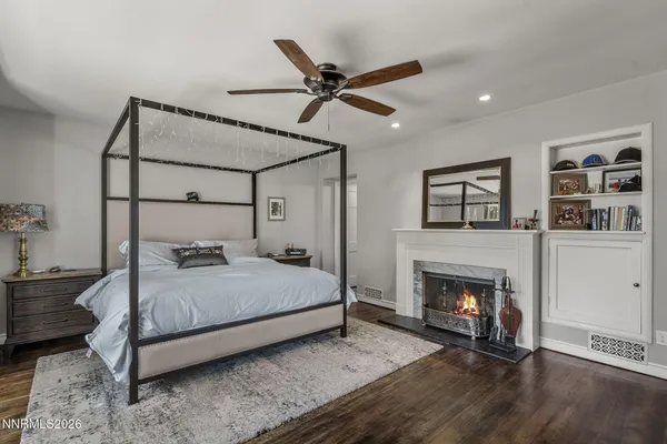 a bedroom with a bed and a fireplace