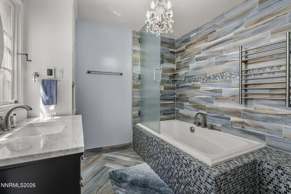 a bathroom with a bathtub and a sink