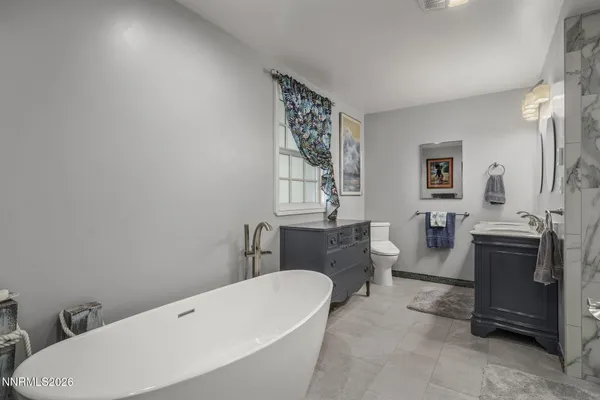 a bathroom with a sink a toilet and bathtub