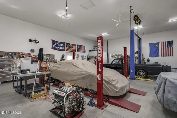 a bed room with furniture and a chandelier