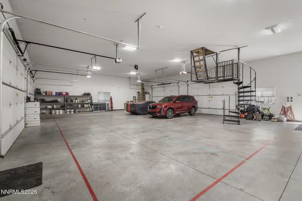 a living room with a table and chairs