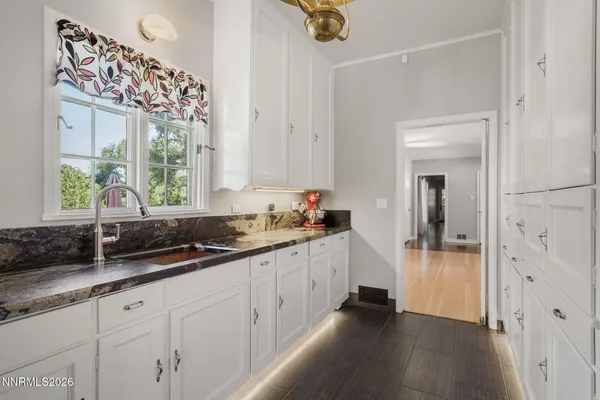 a kitchen with a sink and cabinets