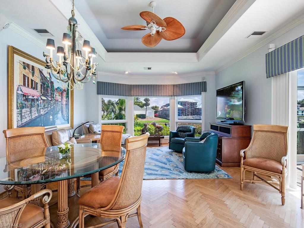3495 Gin Lane Naples, FL 34102 - Photo 12 of 18 a living room with furniture and a large window