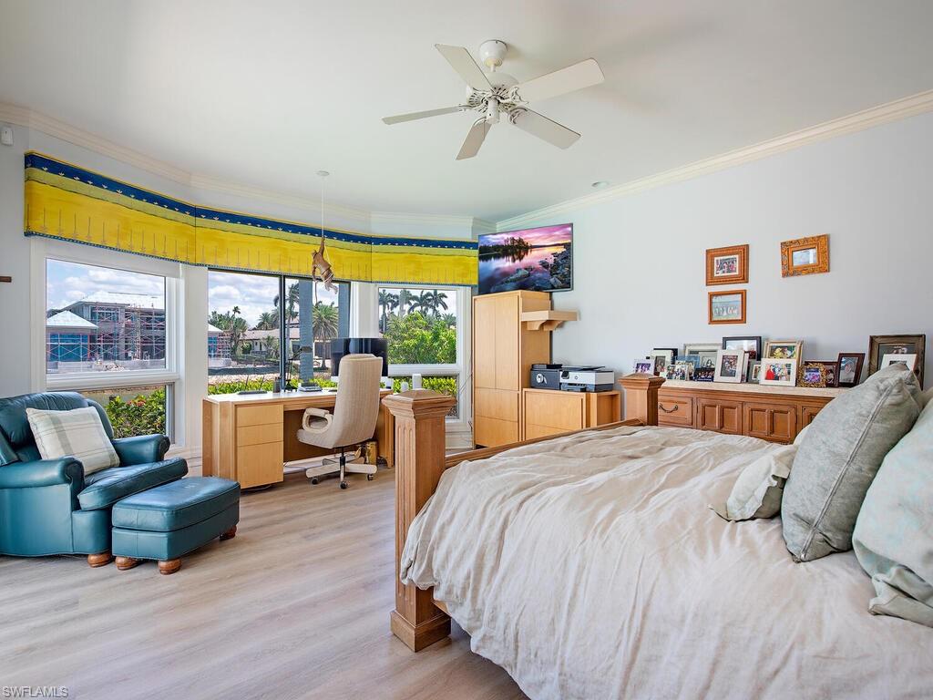 3495 Gin Lane Naples, FL 34102 - Photo 18 of 18 a bed room with a bed and a couch