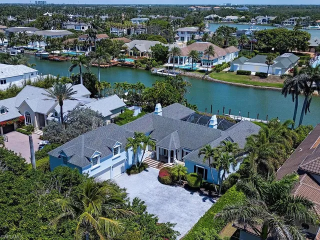 an aerial view of a house with a lake view
