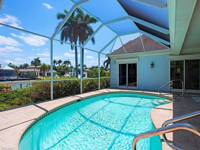 a view of an house with backyard porch and furniture