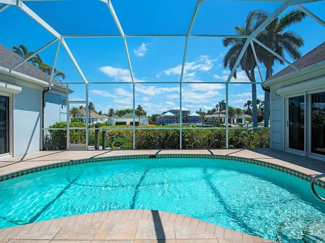 a view of a house with backyard and porch