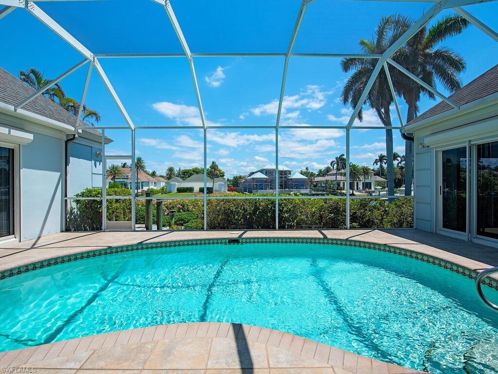 3495 Gin Lane Naples, FL 34102 - Photo 10 of 18 a view of a house with backyard and porch