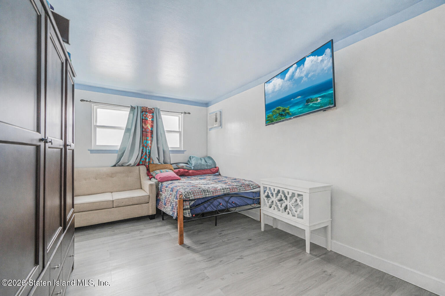 76 Berry Avenue Staten Island, NY 10312 - Photo 31 of 42 a bedroom with bed and a window