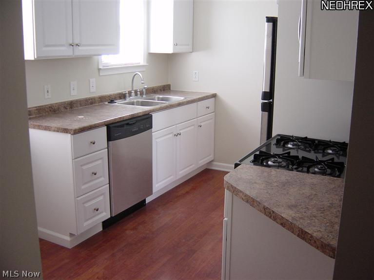 20906 Watson Road Maple Heights, OH 44137 - Photo 7 of 19 Newer Kitchen w/Laminate Woodlike Flooring