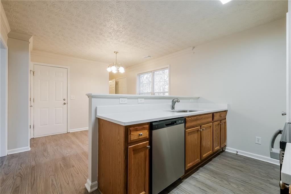 4011 Riverside Parkway Decatur, GA 30034 - Photo 13 of 27 a kitchen with a sink cabinets and wooden floor