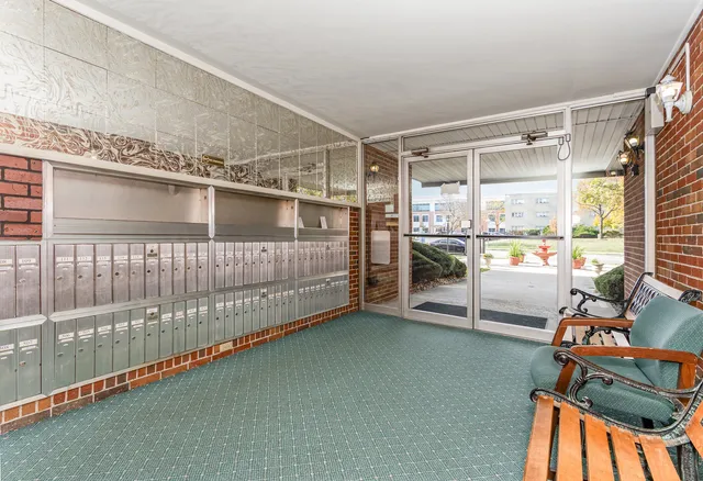 a view of a livingroom with furniture and a window