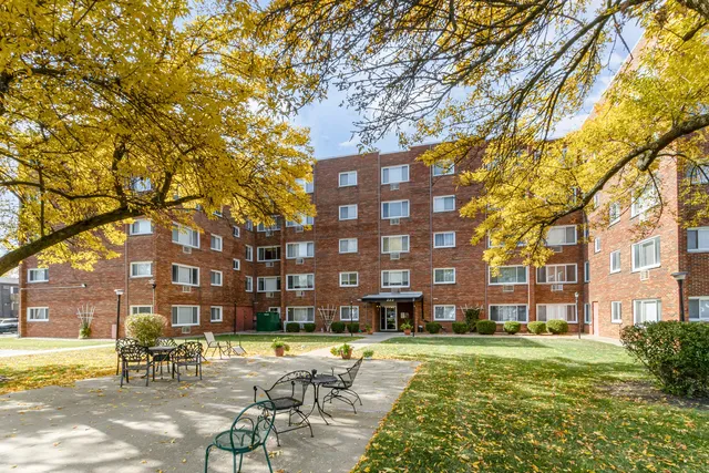 a building view with swimming pool and outdoor space