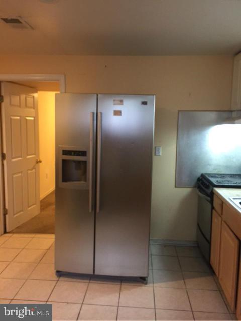 10327 Royal Road Silver Spring, MD 20903 - Photo 2 of 14 a view of a refrigerator in kitchen and a sink