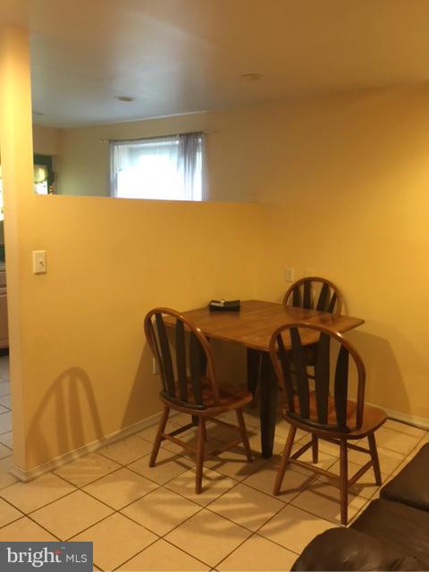 10327 Royal Road Silver Spring, MD 20903 - Photo 4 of 14 a view of a chairs and table in a room