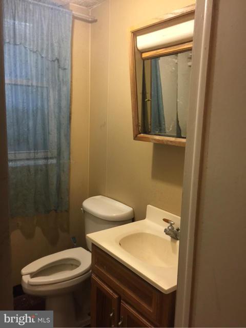 10327 Royal Road Silver Spring, MD 20903 - Photo 6 of 14 a bathroom with a sink a toilet and shower
