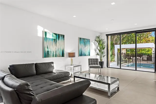 a living room with furniture and white walls